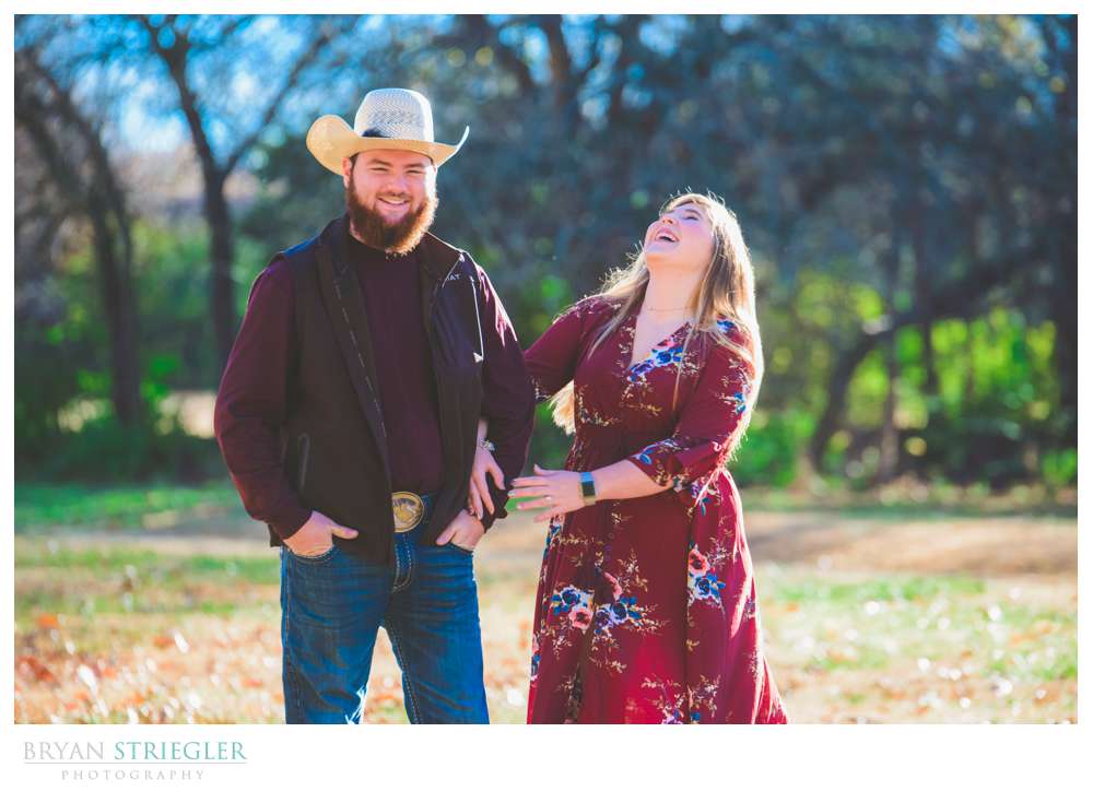 engaged couple laughing during the photo session